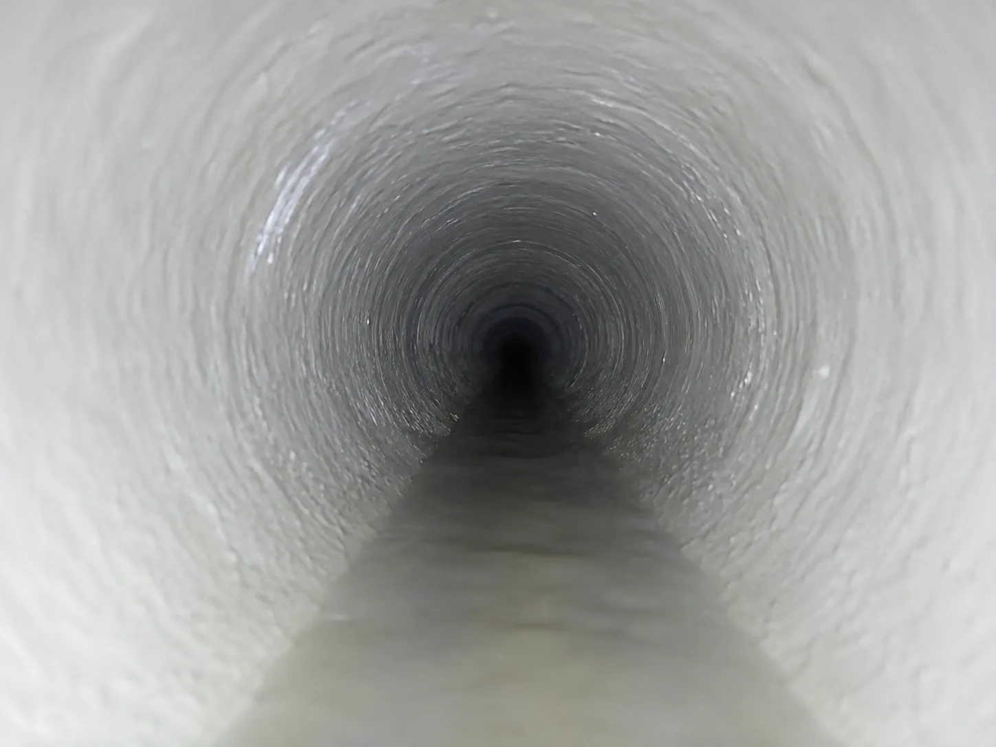 Final camera inspection showing a smooth cured liner inside a repaired San Diego sewer pipe after relining